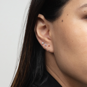 Detailed view of the Stay Close Aquamarine Hoop in silver paired with Stay Close Garnet and Amethyst Hoop.