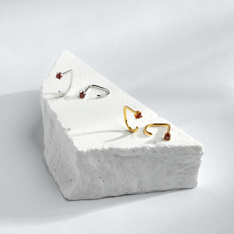 Stay Close Garnet Hoops on a textured white block with a light gray background